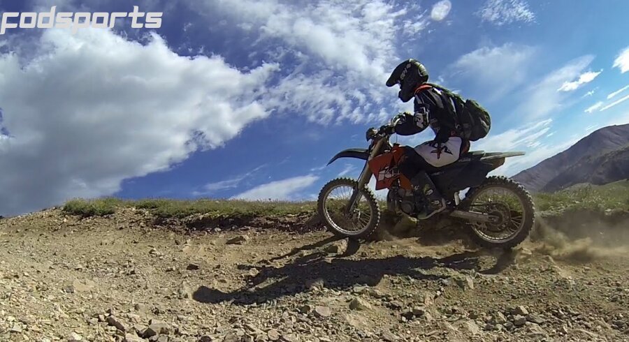 A motorcycle rider enjoys riding in the wild