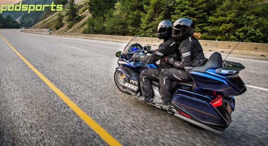 A pair of riders enjoy motorcycle riding on the road