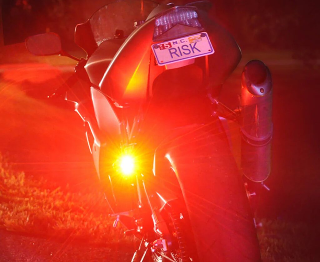 turn on hazard lights when a motorcycle stalls on road