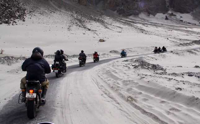 riders are ride in group in winter