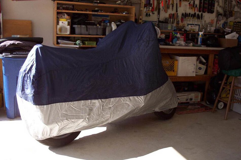 store the motorcycle indoor with cover - winter motorcycle storage ideas