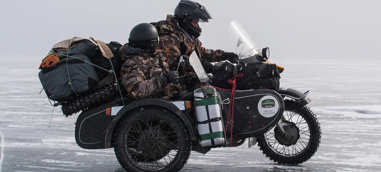 two men riding the Ural Gear Up on the ice at the Lake Baikal